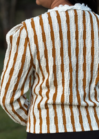 Textured long sleeve top with white and mustard vertical stripes and lace collar, worn outdoors